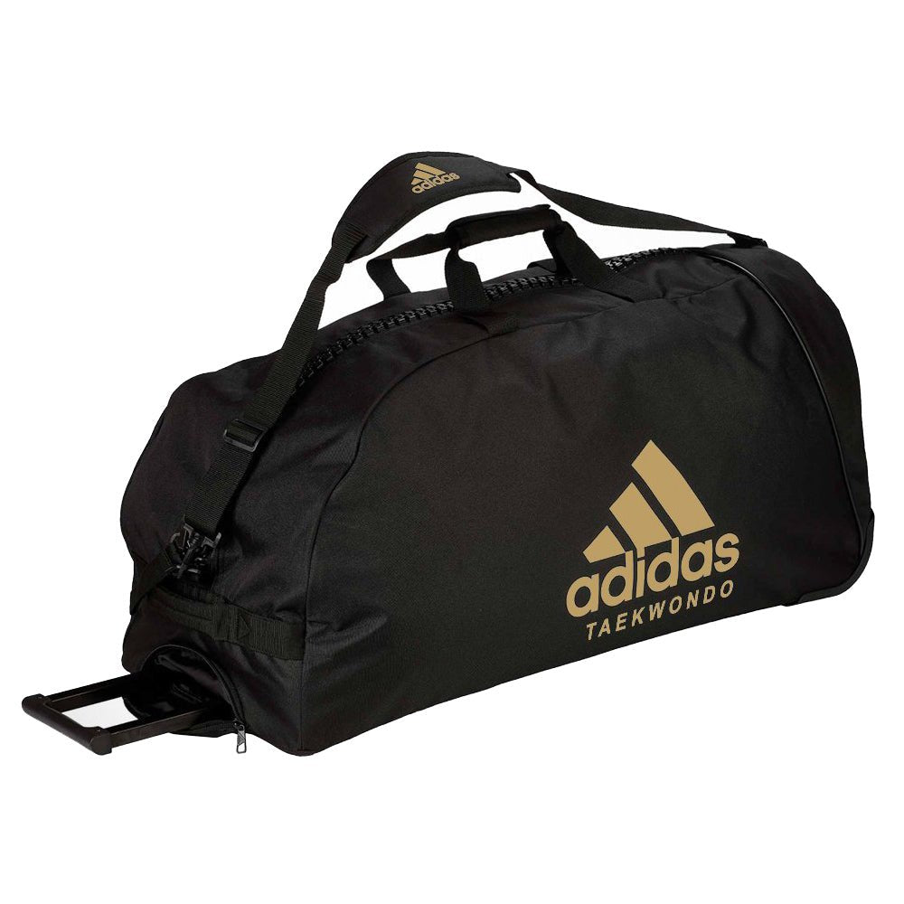 Svart och guldfärgad Adidas Trolley TKD trolleyväska med teleskophandtag och robusta hjul