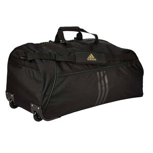 Svart och guldfärgad Adidas Trolley TKD trolleyväska i slitstark nylon med vadderade bärhandtag