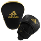 Svarta och guldfärgade Adidas Star Pro Speed fokusmittsar med kardborrerem och vaddering mot handleden