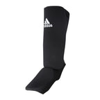 Svarta Adidas ben- och vristskydd med justerbara kardborrespännen