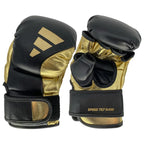 Svarta och guldfärgade Adidas Speed Tilt G450 MMA-handskar med TILT-design för naturlig handposition